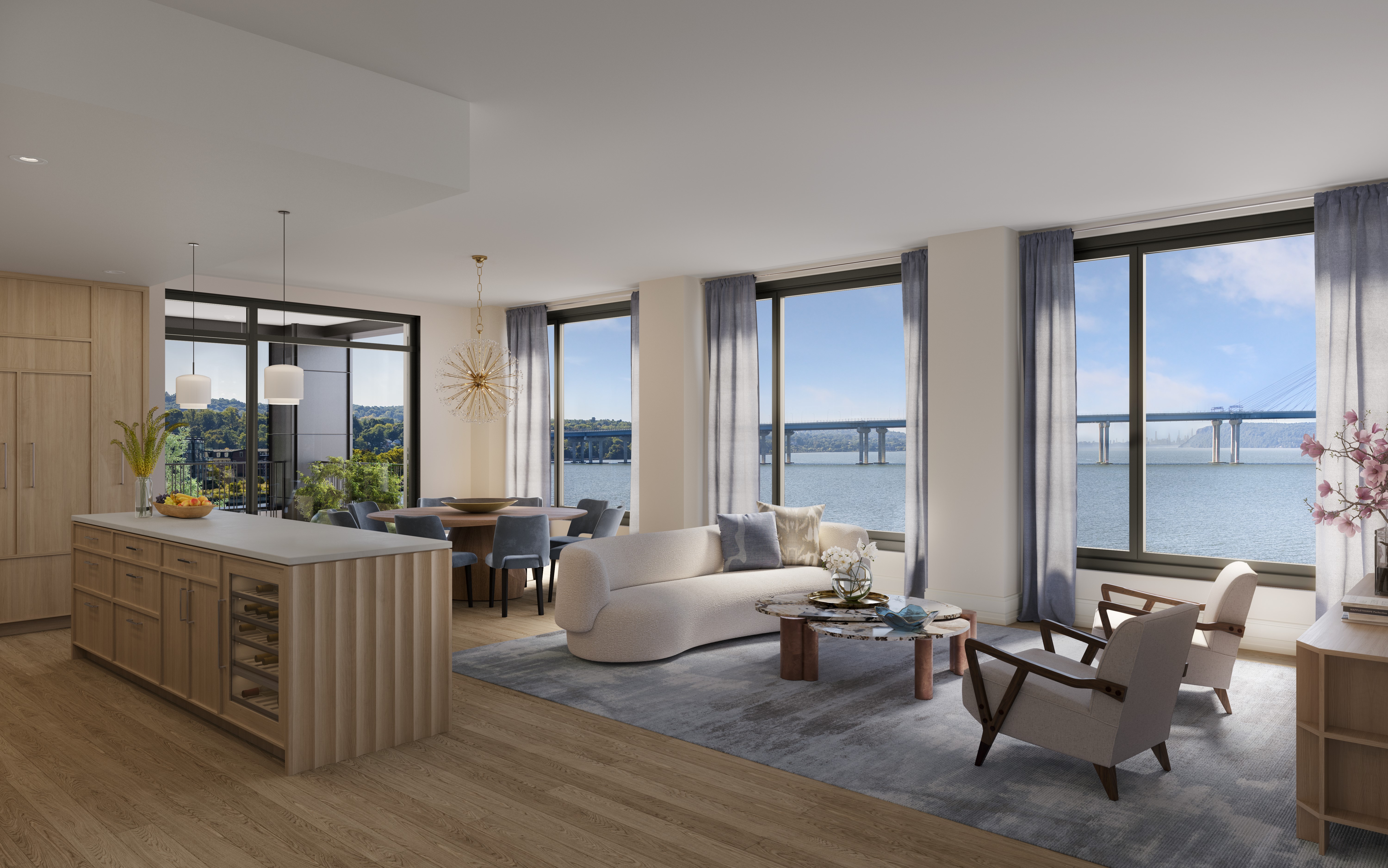 Open-plan kitchen and living room at The Daymark featuring Shinnoki Ivory Oak panels and cabinetry, with panoramic Hudson River views.
